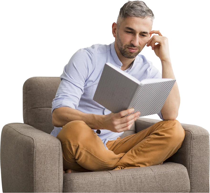 Man reading on armchair